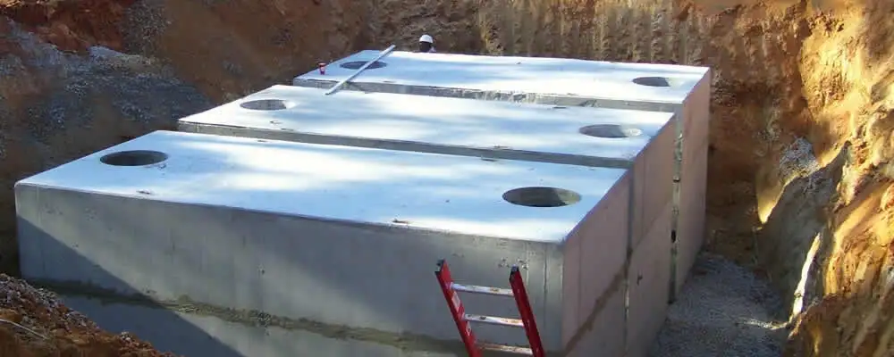 Septic tank installation site with a newly placed concrete tank in Oakland, CA